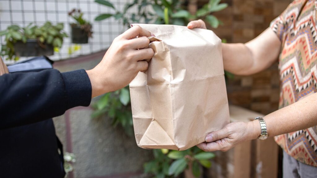 handing over a bag